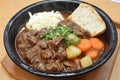 Beef stew with potatoes cooked in a crock pot, accompanied by toast. Royalty Free Stock Photo