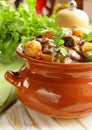 Beef stew with vegetables and herbs in a clay pot Royalty Free Stock Photo