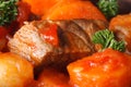 Beef stew with vegetables in a tomato macro