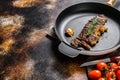 Beef strip loin steak in a frying pan. Space for text. Marble premium beef Royalty Free Stock Photo