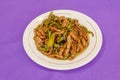 Beef strips with pepper strips cooked in a wok in a Chinese restaurant Royalty Free Stock Photo