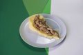 Beef stroganoff with mashed potatoes side dish served on gray plate on green colourful background