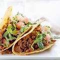 Beef tacos with lettuce cheese and tomato Royalty Free Stock Photo