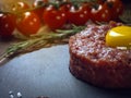 Beef tartar with an egg on a stone plate. Royalty Free Stock Photo