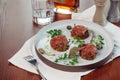 Above view of salmon tartar on a dark wooden background, studio shot Royalty Free Stock Photo