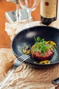 Above view of salmon tartar on a dark wooden background, studio shot Royalty Free Stock Photo