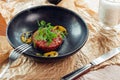 Above view of salmon tartar on a dark wooden background, studio shot Royalty Free Stock Photo