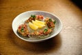 Beef tartar with salad and garlic toast on dark bread Royalty Free Stock Photo