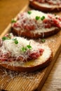 Beef tartar with salad and garlic toast on dark bread Royalty Free Stock Photo