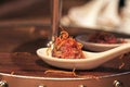 Beef tartare with fried onion on a spoon