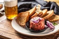 Beef tartare with red onion toast bread garlic and draft beer Royalty Free Stock Photo