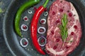 Beef Tenderloin and marbled beef steak on grill pan and frying board with seasoning, black background top view Royalty Free Stock Photo