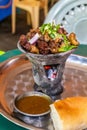 Beef tibs being prepared on a traditional server over hot charcoal in a restaurant in Jinka, Ethiop