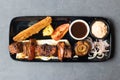 Beef tikka Boti kabab with chili sauce, dip and onion served in dish isolated on table top view of asian and indian food Royalty Free Stock Photo
