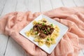 Beef tips over bow tie pasta and Alfredo sauce Royalty Free Stock Photo