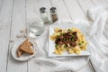 Beef tips over bow tie pasta and Alfredo sauce Royalty Free Stock Photo