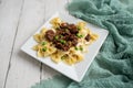 Beef tips over bow tie pasta and Alfredo sauce Royalty Free Stock Photo