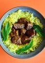 Beef vindaloo with saffron rice on a plate Royalty Free Stock Photo
