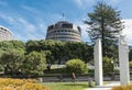 Beehive Adminstrative Building behind Maori symbols in Wellington.