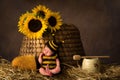 Beehive and baby in bee outfit