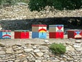 A row of five multicoloured patterned Beehives in greece