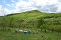 Beehives standing on the green hill