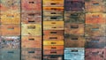 Beekeeper beekeeping background wallpaper - Wall texture made of many old rustic wooden beehives stacked on top of each other Royalty Free Stock Photo