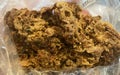 Propolis scrapings from beehives in a plastic bag. Beekeeping