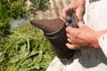Beekeeper with smokepot at apiary outdoors, closeup Royalty Free Stock Photo