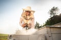 A beekeeper smokes bees in the process of collecting honey in wooden colored beehives. Beekeeping tool Royalty Free Stock Photo