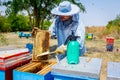 Beekeeper is using bristle to get rid of bees