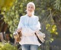 Beekeeper woman, portrait and smile with protective suit, happy and work outdoor in agriculture. Senior bee farmer