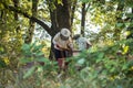 Beekeepers is working with bees and beehives on the apiary. Authentic scene of life in garden Royalty Free Stock Photo