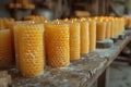 Beekeeping craftsmanship: The delicate art of hand-rolling beeswax candles in a rustic workshop setting