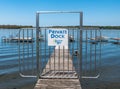 Beemus Point, New York, USA May 11, 2023 A closed gate on a private pier on Lake Chautauqua Royalty Free Stock Photo