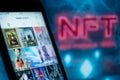 Beeple instagram page on NFT non fungible token 3d neon text on blue background. New way to buy digital assets