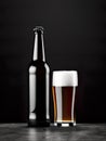 Beer in all its glory, with a beer bottle and a glass filled with the golden brew set against a sleek black background. Royalty Free Stock Photo