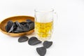 Beer background. Fresh beer and potato chips in a wooden plate. Free space for text Royalty Free Stock Photo