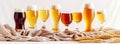 Beer banner with different kind of beer in glasses on white table with wheat ears Royalty Free Stock Photo