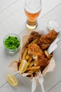 Beer, battered fish and chips. Mashed green peas and salad Royalty Free Stock Photo