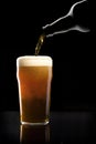 Beer being poured into glass Royalty Free Stock Photo