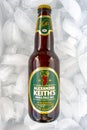 A beer bottle of an Alexander Keith`s in a bed of ice. India Pale Ale is light in colour and hopped in flavour Royalty Free Stock Photo
