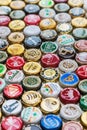 beer bottle caps background, mix of different world brands Royalty Free Stock Photo