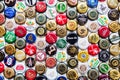 beer bottle caps background, mix of different world brands Royalty Free Stock Photo