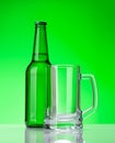 Beer bottle and empty glass beer Royalty Free Stock Photo