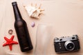 Beer bottle and glass on a sandy beach. Royalty Free Stock Photo