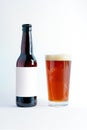 Beer Bottle Mock-Up with glass of altbier and foam. Blank Label Royalty Free Stock Photo