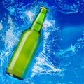 Beer bottle in water Royalty Free Stock Photo