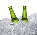 Beer bottle with water drops of cold beverage, ice cube a of juicy. Summer refreshing drink Royalty Free Stock Photo