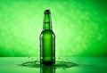 Beer bottle with water drops on the green color smoke background Royalty Free Stock Photo